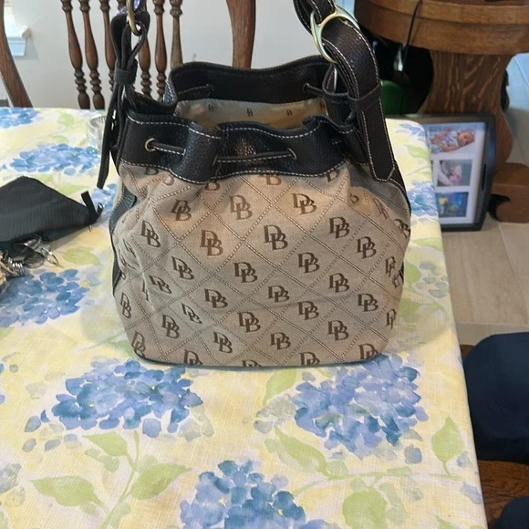 Dooney & Bourke Brown and Tan Shoulder Bag 10 x 12 x 6 drawstring closure - Picture 4 of 10